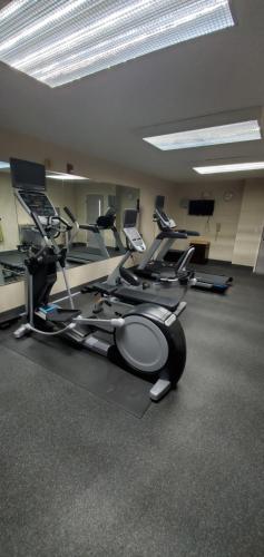 a gym with a bunch of exercise bikes in a room at Holiday Inn Express Hotel & Suites Kinston by IHG in Kinston