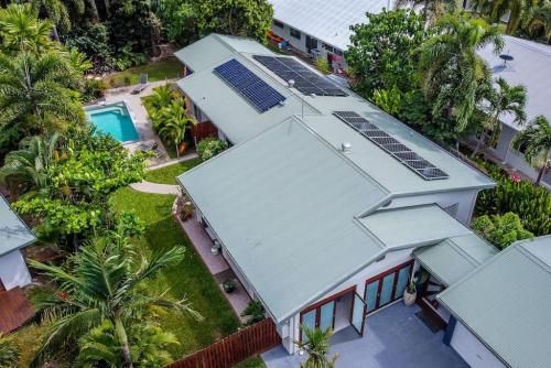 an overhead view of a house with solar panels on it at Mango Wood Villa Tropical Coastal living in Clifton Beach