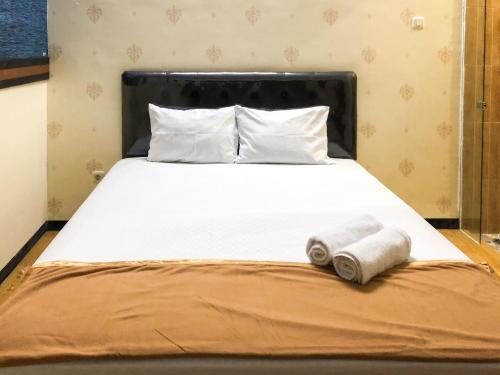 Postel nebo postele na pokoji v ubytování Urbanview Hotel Gangnam near Mall Olympic Garden