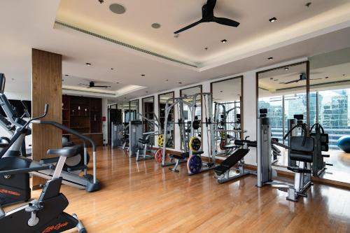 a gym with treadmills and elliptical machines at Hotel Indigo Bangkok Wireless Road by IHG in Bangkok