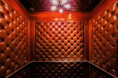 a room with a wooden wall with a ceiling at Hotel Indigo Bangkok Wireless Road by IHG in Bangkok