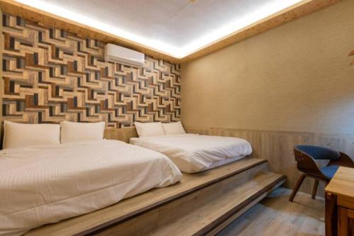 Ένα ή περισσότερα κρεβάτια σε δωμάτιο στο Yao Woo B&B