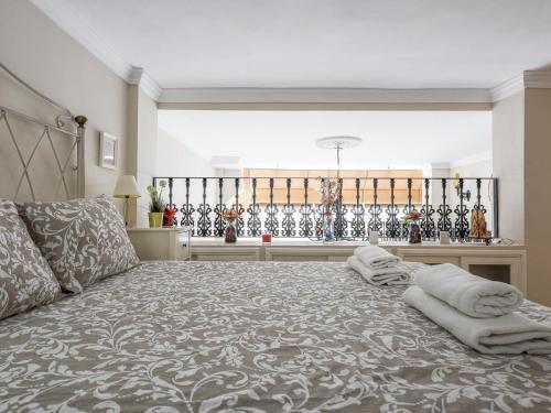 Posteľ alebo postele v izbe v ubytovaní Sueños de Sevilla duplex a calidades