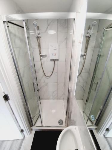 a bathroom with a shower and a toilet at Southend on Sea - Westcliff Studios - Great Location in Southend-on-Sea