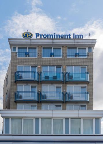 a building with a sign on top of it at Prominent Inn Hotel in Noordwijk aan Zee