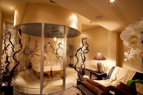 a room with a large glass case in a living room at Der Unterschwarzachhof in Saalbach Hinterglemm