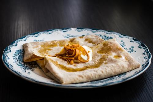 a blue and white plate with some food on it at Citybox Oslo in Oslo