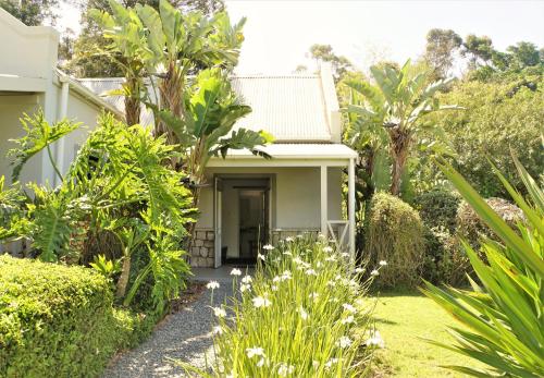 a house with a garden in front of it at Swellendam Country Lodge - Guest House - B&B in Swellendam
