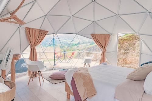Postel nebo postele na pokoji v ubytování Guaia Terra Glamping