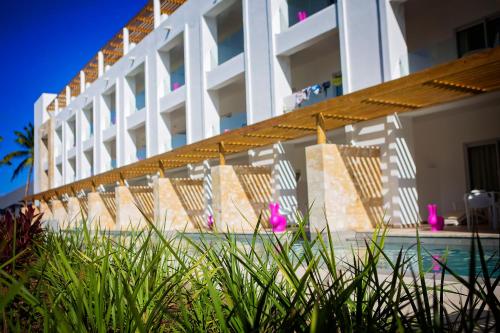 a row of chairs sitting in front of a building at Princess Family Club Bavaro - All Inclusive in Punta Cana