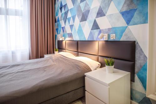 Ένα ή περισσότερα κρεβάτια σε δωμάτιο στο Gruda Apartments, ŚNIADANIA, Bezpłatny Parking, Faktury VAT