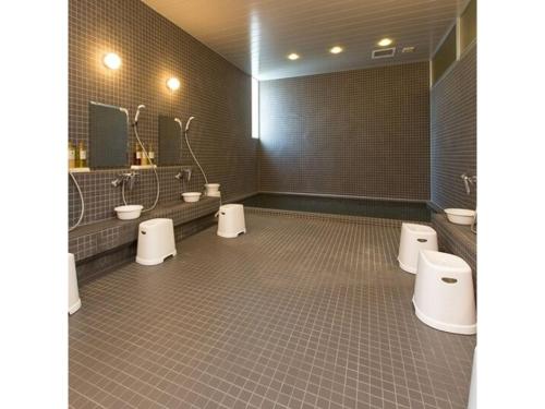 a bathroom with three toilets and three sinks at OGAL INN - Vacation STAY 01855v in Akaishi