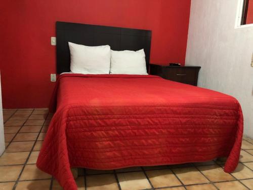 Postel nebo postele na pokoji v ubytování Hostal de los Reyes