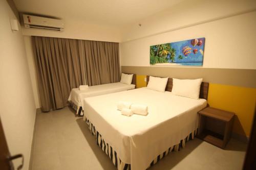 מיטה או מיטות בחדר ב-Apartamento em Resort de Olímpia ao lado do Parque Aquático