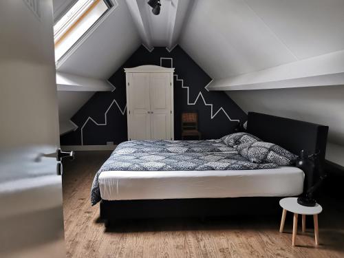 Un pat sau paturi într-o cameră la KoksenCo