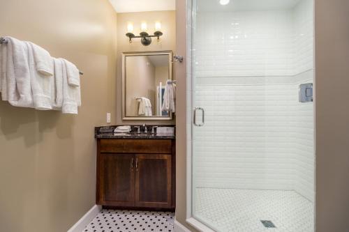 a bathroom with a glass shower with a sink at Holiday Inn Club Vacations Williamsburg Resort in Williamsburg