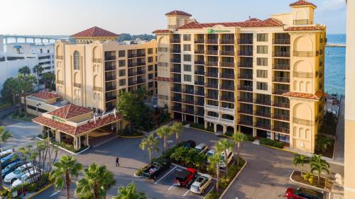 an aerial view of a resort with a parking lot at Holiday Inn & Suites Clearwater Beach by IHG in Clearwater Beach