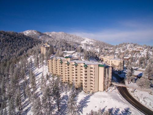a resort in the snow with a mountain at Holiday Inn Club Vacations - Tahoe Ridge Resort in Stateline