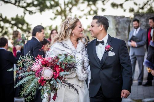 a bride and groom walking down the aisle at their wedding at Holiday Inn Club Vacations - Tahoe Ridge Resort in Stateline
