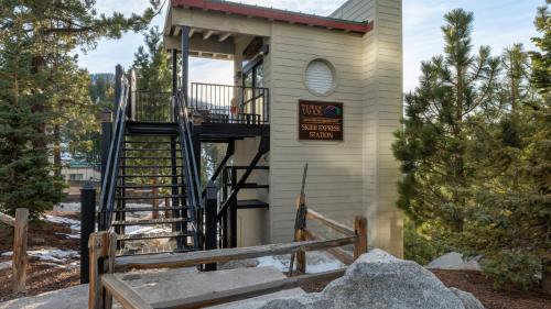 a building with a staircase leading up to a house at Holiday Inn Club Vacations - Tahoe Ridge Resort in Stateline