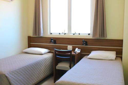Katil atau katil-katil dalam bilik di Tri Hotel Smart Chapecó