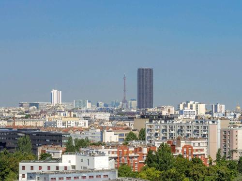 a view of a city with buildings in the background at ibis Styles Paris Meteor Avenue d'Italie in Paris
