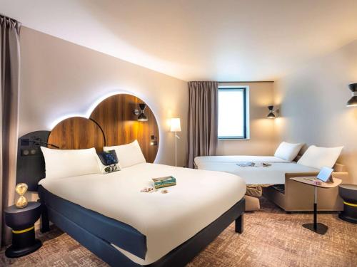 En eller flere senge i et værelse på ibis Styles Paris Meteor Avenue d'Italie