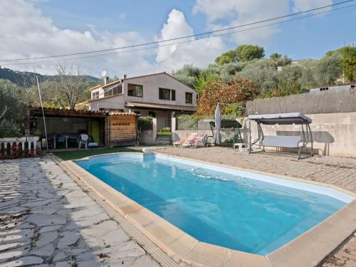 a swimming pool in front of a house at Quiet house in Drap with swimming pool in Drap