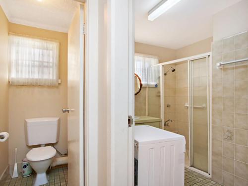 a bathroom with a toilet and a sink and a shower at Como Unit 5 in Gold Coast