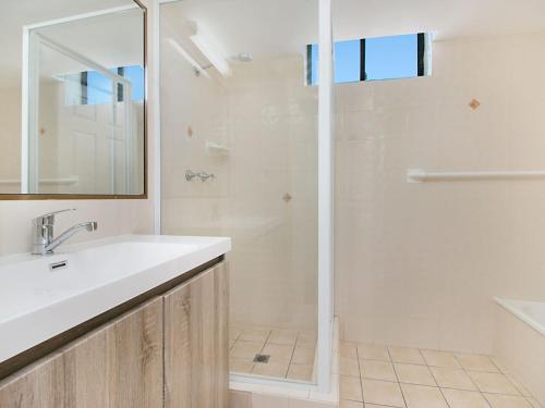 a bathroom with a white sink and a shower at Chateau Royale Unit 36 in Gold Coast