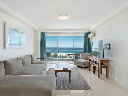 a living room with a couch and a table at Ocean Plaza Unit 936 in Gold Coast