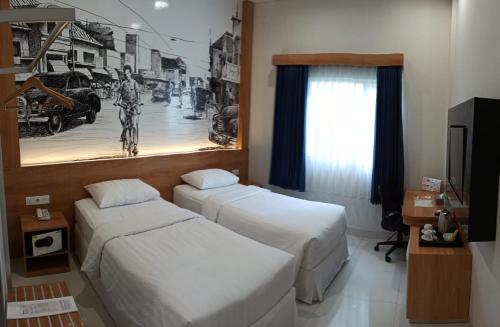 Tempat tidur dalam kamar di Choice City Hotel