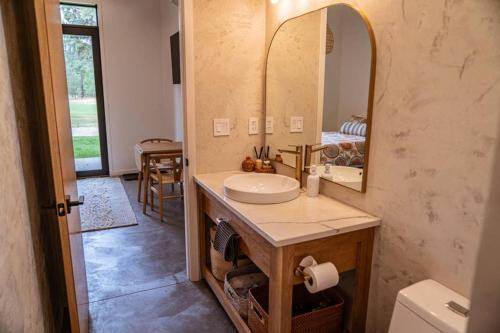 a bathroom with a sink and a mirror at Studio on the Fairway Chewelah Golf Course in Chewelah