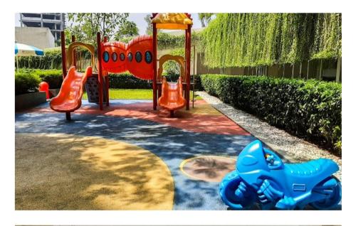 a playground with a blue toy motorcycle on a playground at Apartment Altiz 2 br Bintaro Plaza Residence in Pondoklang