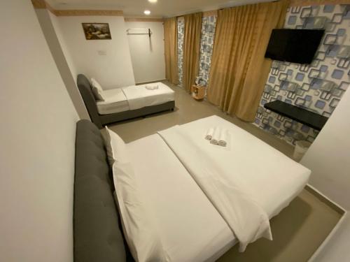 מיטה או מיטות בחדר ב-Shobi Hotel Johor Bahru Near CIQ JB
