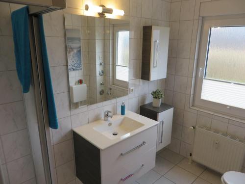 a bathroom with a sink and a mirror at Ferienanlage-Reriker-Strasse-Bella-Vista-736 in Kühlungsborn