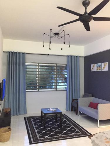 a living room with a ceiling fan and a couch at Cinnamon Sutravilla Unit No D3A6 Lift Level 4, Sutravilla 2 in Kuantan