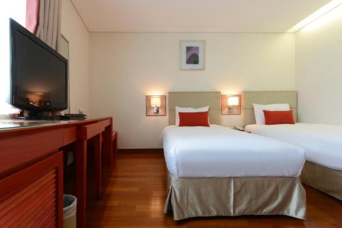 Кровать или кровати в номере Hotel Prince Seoul