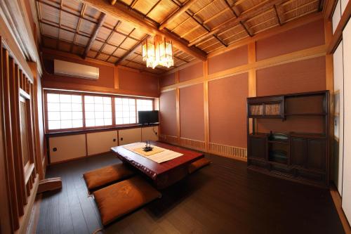 a room with a table and a couch in it at 宍粟片山 in Shiso