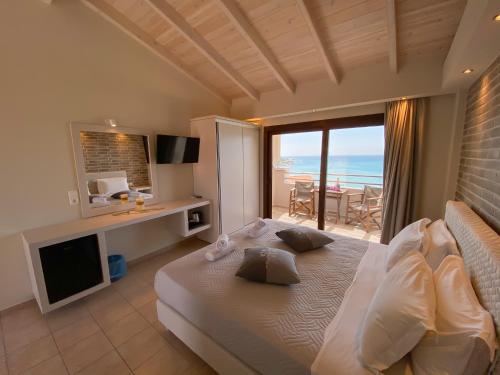 Posteľ alebo postele v izbe v ubytovaní Tereza's Sunset Hotel
