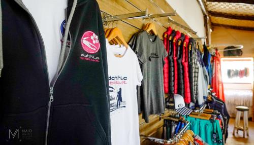 a rack of surfboards and shirts in a store at Dakhla Attitude in Dakhla