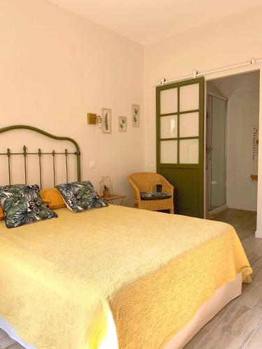 a bedroom with a large bed with two pillows at Domaine de Sévanes in Saint-Paul-les-Fonts