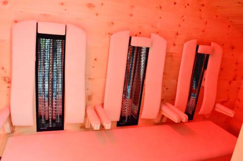 a room with three servers on a wall at Kleintödlinggut in Leogang