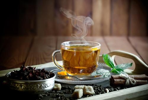 a cup of tea sitting on a table with smoke at Holiday Inn Dhaka City Centre by IHG in Dhaka