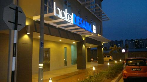a building with a sign that reads hicks pharmacy at Hotel Desaria in Petaling Jaya