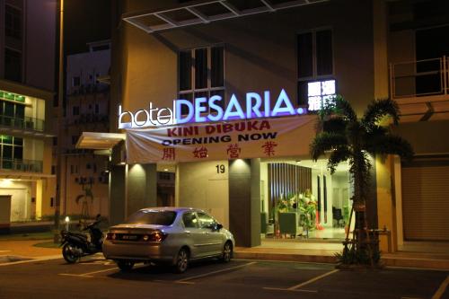 a car parked in front of a hotel at night at Hotel Desaria in Petaling Jaya