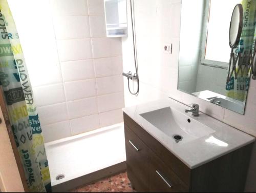 a bathroom with a sink and a shower and a tub at Apartment with terrace in Vecindario