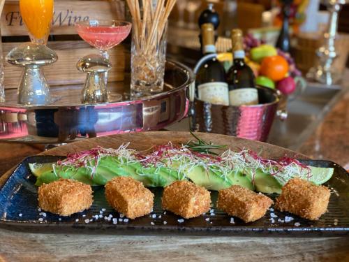 a plate of food on a table with food at Hotel Wegner - T h e culinary art hotel in Hannover