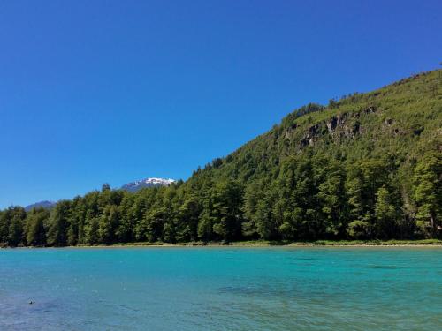 a view of a lake with a mountain in the background at Puelo Libre in Llanada Grande