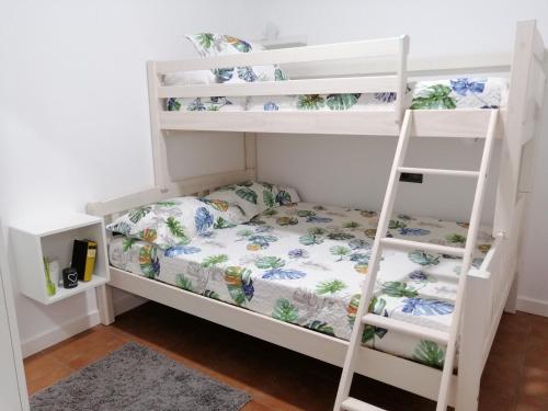 Кровать или кровати в номере Casajardín ROKEKRIS